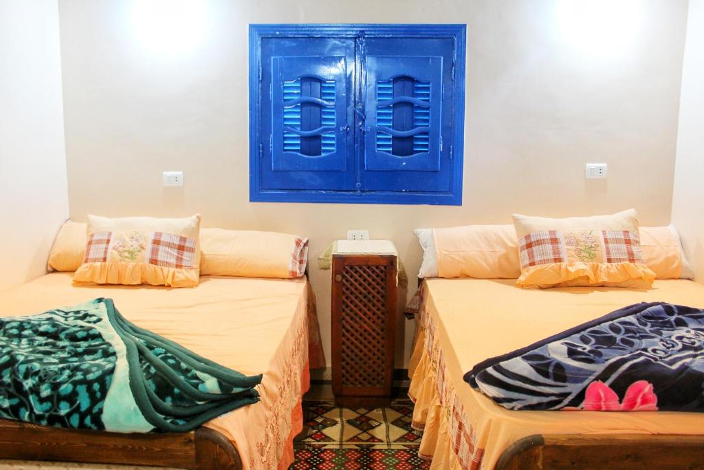 Postel nebo postele na pokoji v ubytování Tunis Village Chalet