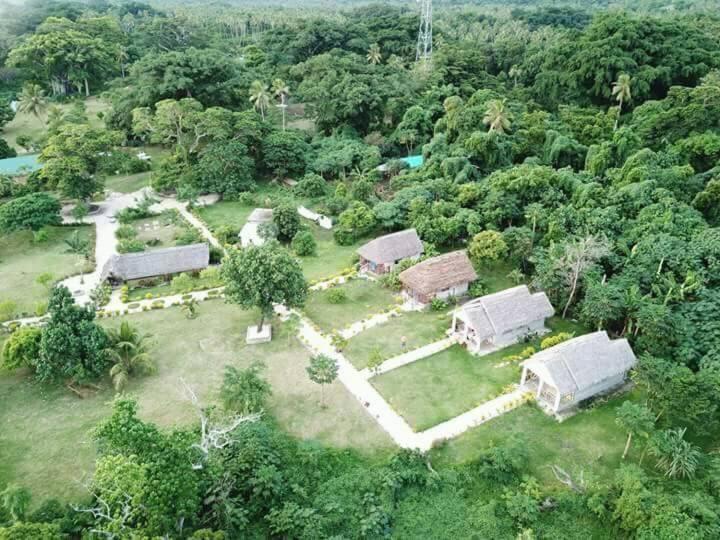 an aerial view of a farm with buildings and trees at Alofa Beach Bungalows in Tanna Island