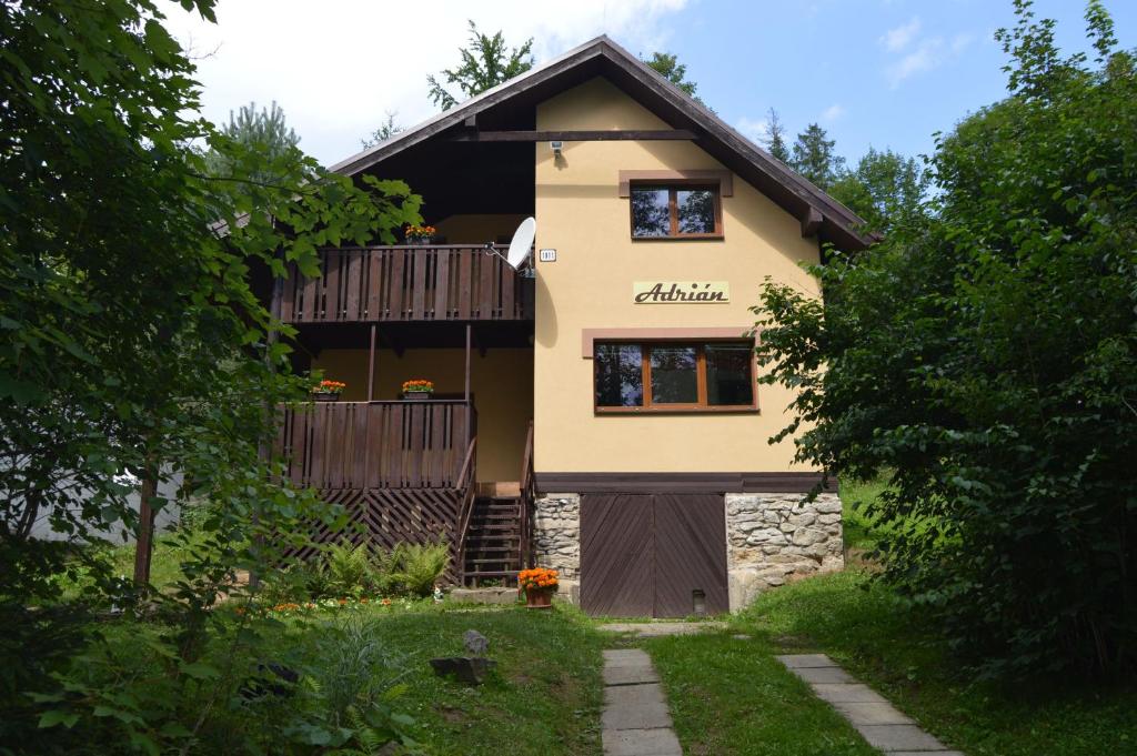 a house with a balcony on the side of it at Chata Adrian Slovak Paradise in Spišské Tomášovce