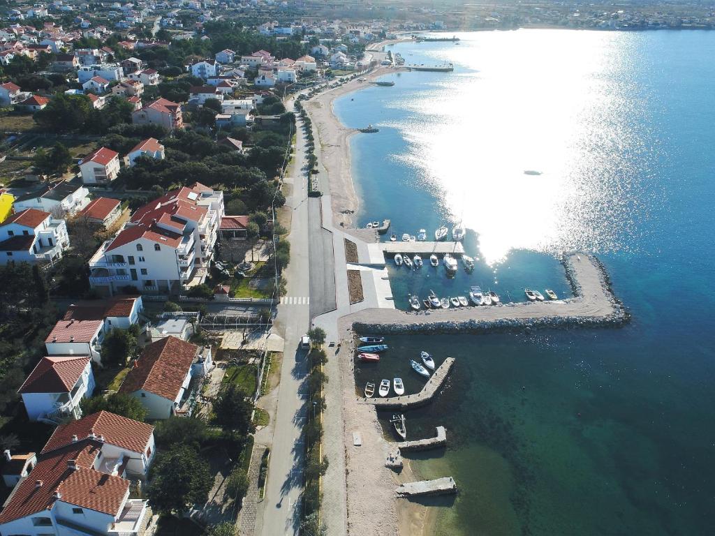 an aerial view of a beach with boats in the water at Villa Vukic in Vrsi