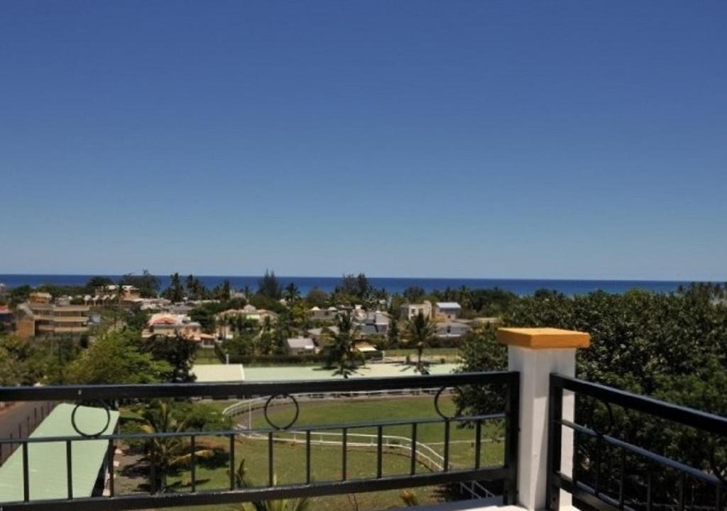 a view from the balcony of a house at Trou Aux Biches Self Catering Apartment in Trou aux Biches