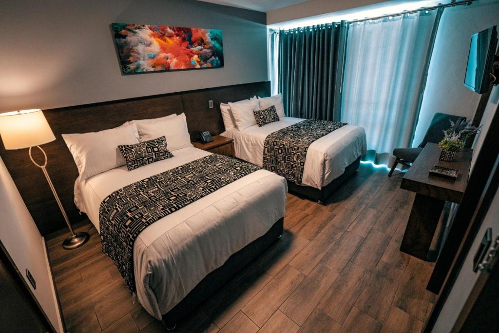 Postel nebo postele na pokoji v ubytování Hotel Corral Grande