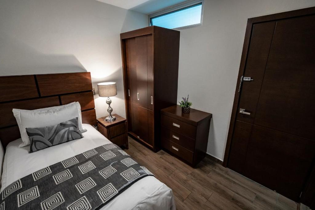 Postel nebo postele na pokoji v ubytování Hotel Corral Grande