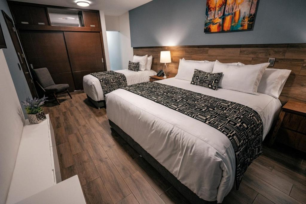 Postel nebo postele na pokoji v ubytování Hotel Corral Grande