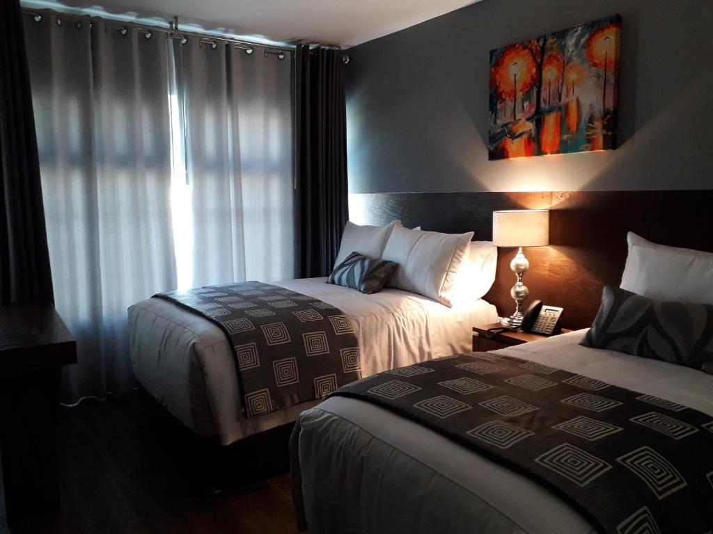 Postel nebo postele na pokoji v ubytování Hotel Corral Grande