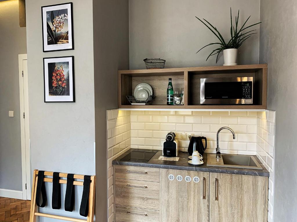 Kuchyň nebo kuchyňský kout v ubytování SleepWell Apartments Ordynacka