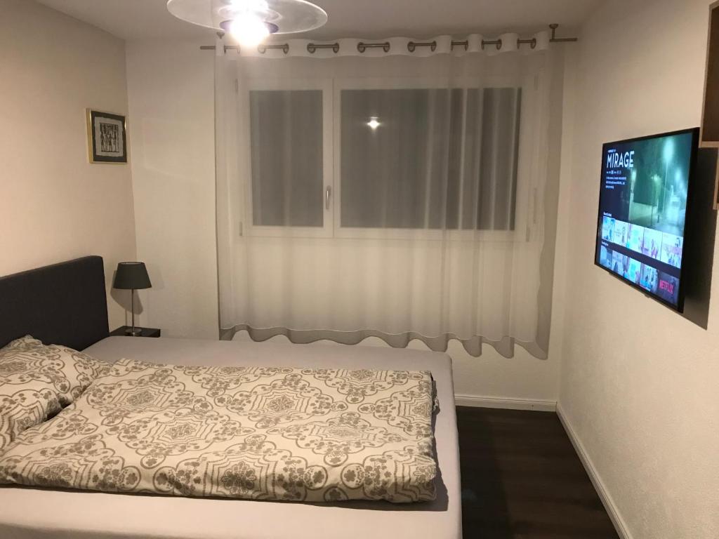 Ein Bett oder Betten in einem Zimmer der Unterkunft Apartment im Emmental
