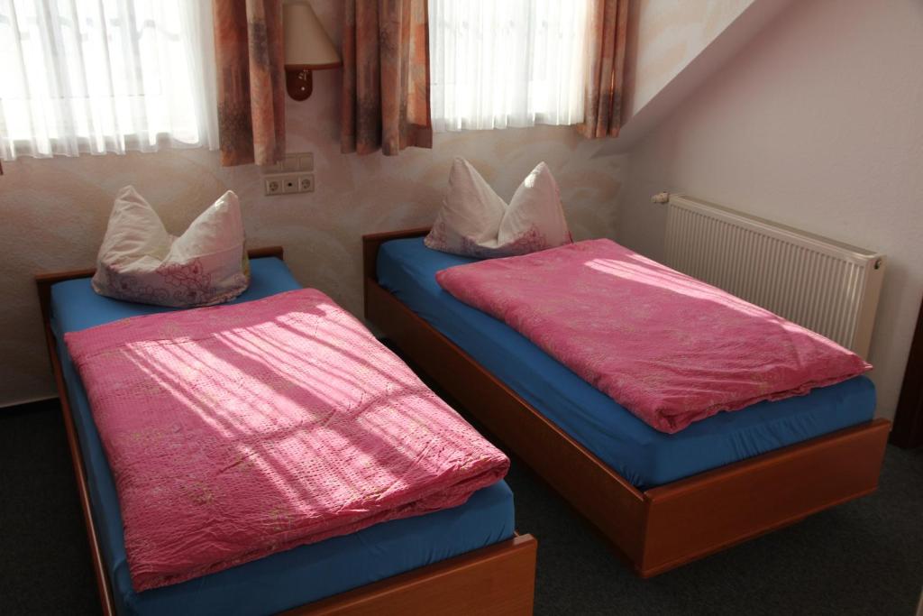 Postel nebo postele na pokoji v ubytování Wehrstedter Hof