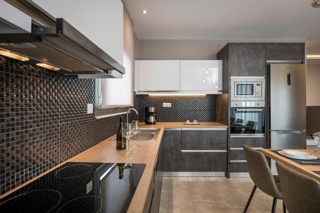 Kuchyň nebo kuchyňský kout v ubytování Mirma Luxury Apartment