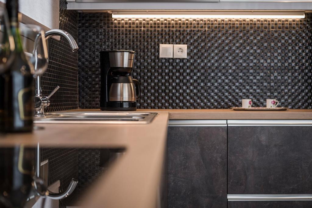 Kuchyň nebo kuchyňský kout v ubytování Mirma Luxury Apartment
