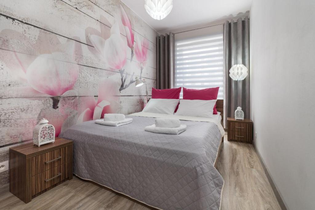 Posteľ alebo postele v izbe v ubytovaní Apartament Sweet House