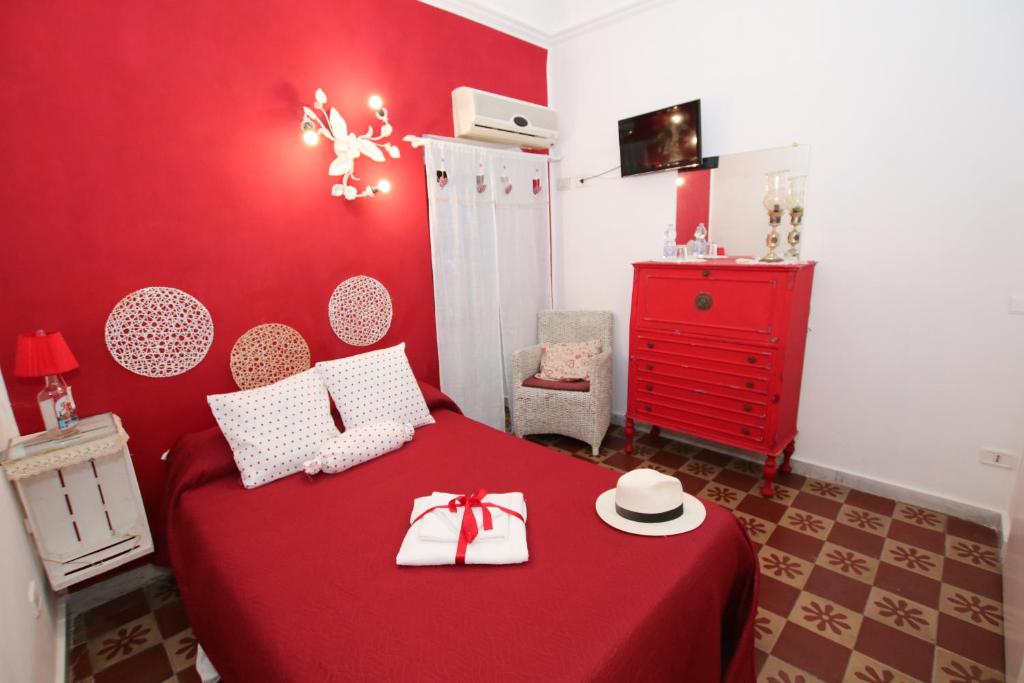 A bed or beds in a room at La Zagara B&B