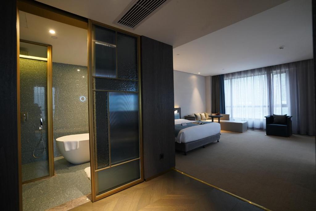 Koupelna v ubytování Hangzhou Cosy Park Hotel(Liangzhu)
