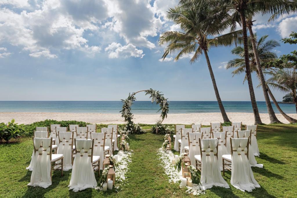 a set up for a wedding on the beach at The Surin Phuket in Surin Beach