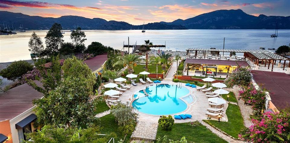 an aerial view of a resort with a swimming pool at Fİ Light Solto Boutique Beach Hotel in Selimiye