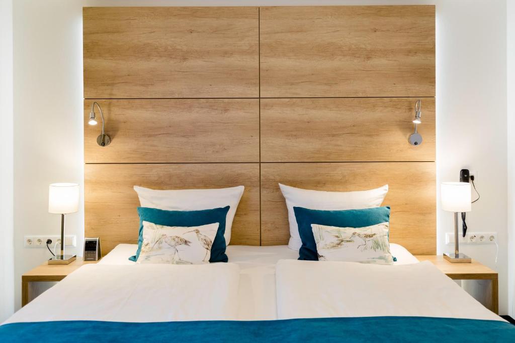 Postel nebo postele na pokoji v ubytování Hotel Restaurant Zwergschlösschen