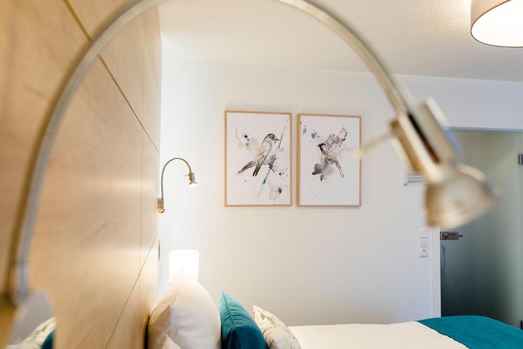 Postel nebo postele na pokoji v ubytování Hotel Restaurant Zwergschlösschen