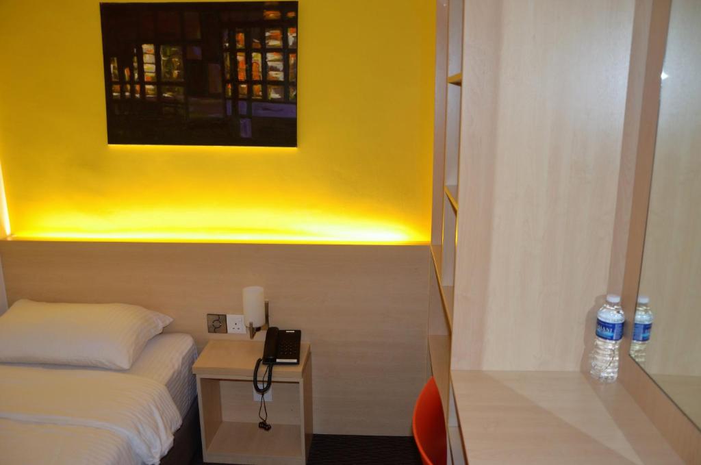 Postel nebo postele na pokoji v ubytování Hotel Jeti Tg Gemok