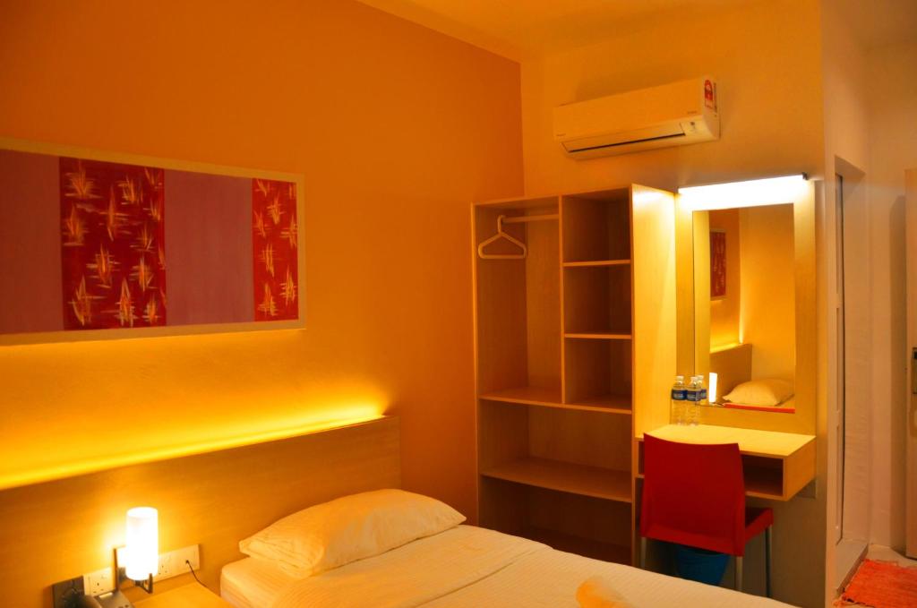 Postel nebo postele na pokoji v ubytování Hotel Jeti Tg Gemok