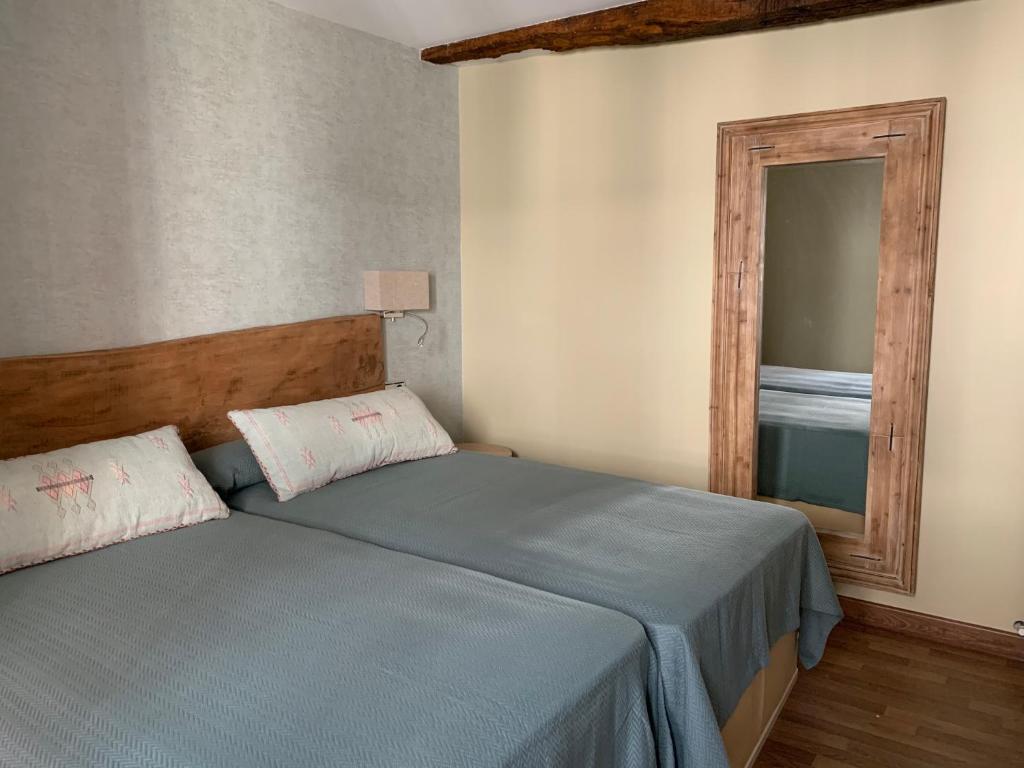 Posteľ alebo postele v izbe v ubytovaní Hostal El Resbalon