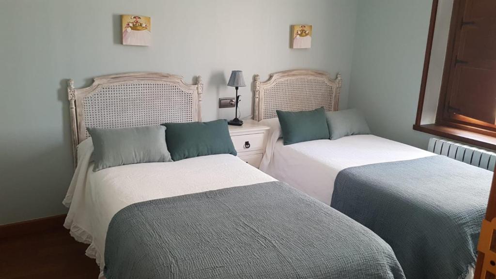 Posteľ alebo postele v izbe v ubytovaní Hostal El Resbalon