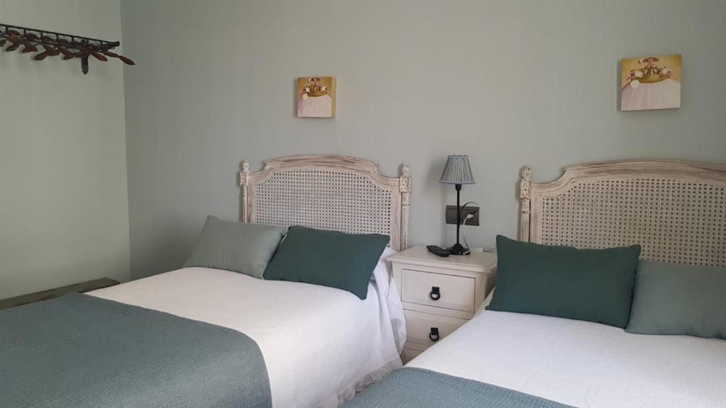 Posteľ alebo postele v izbe v ubytovaní Hostal El Resbalon