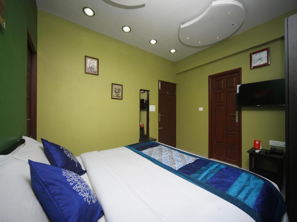 Postel nebo postele na pokoji v ubytování Max Classic Serviced Apartment