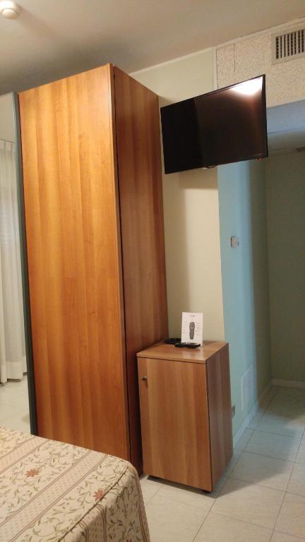 Postel nebo postele na pokoji v ubytování La Perla B&B Hotel