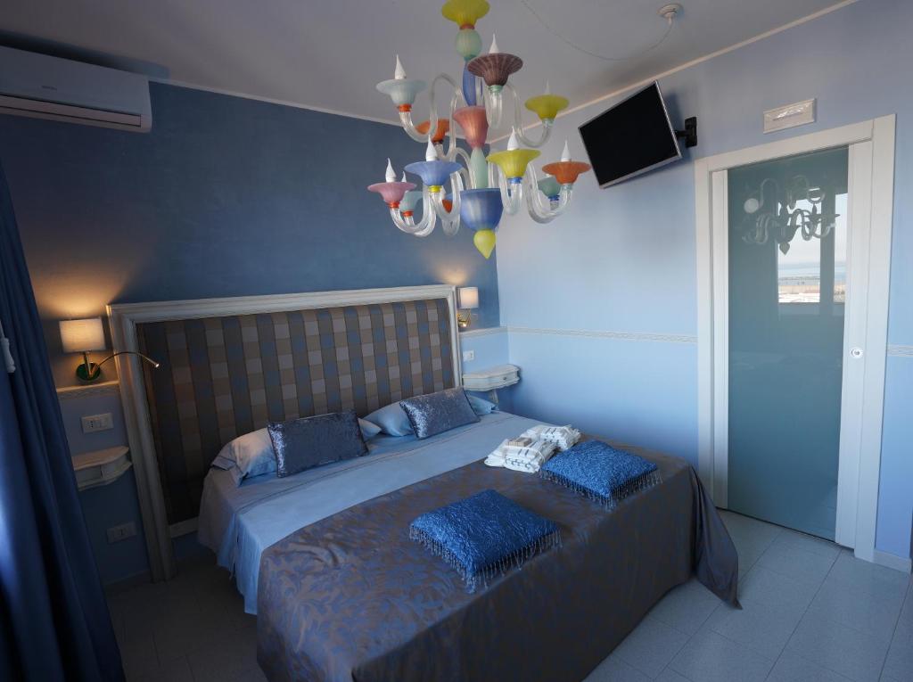 Postel nebo postele na pokoji v ubytování B&B Sogno D'Estate