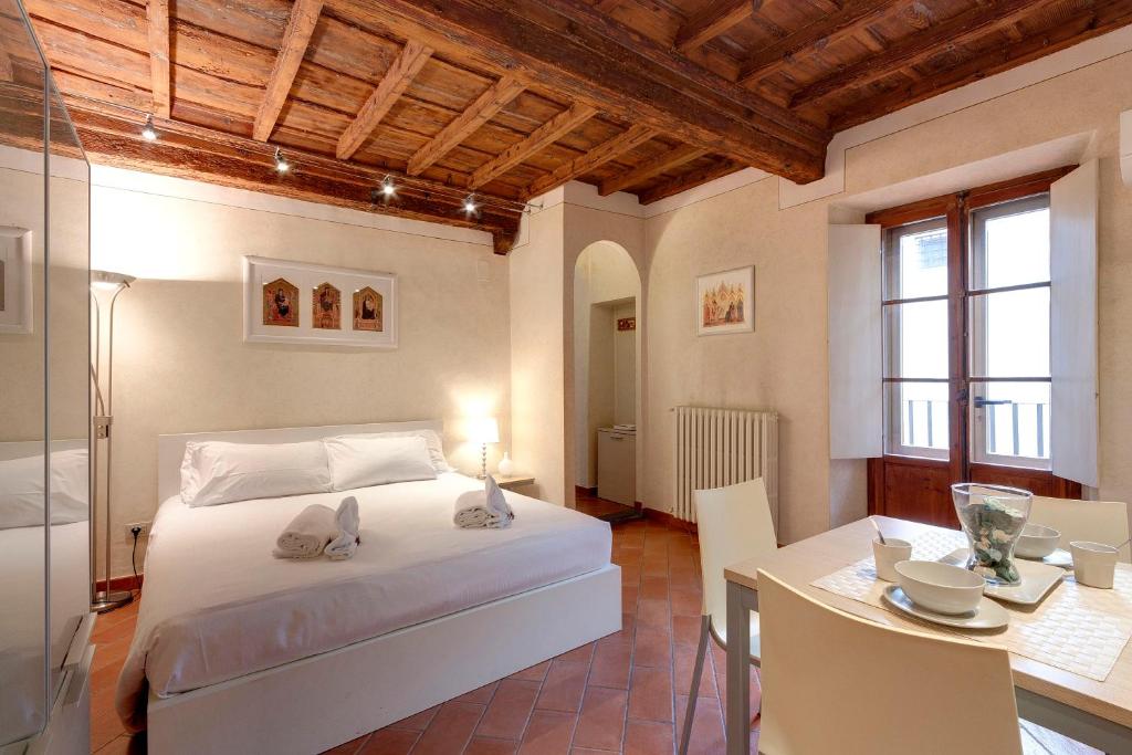 מיטה או מיטות בחדר ב-Mamo Florence - Cupolone Apartment