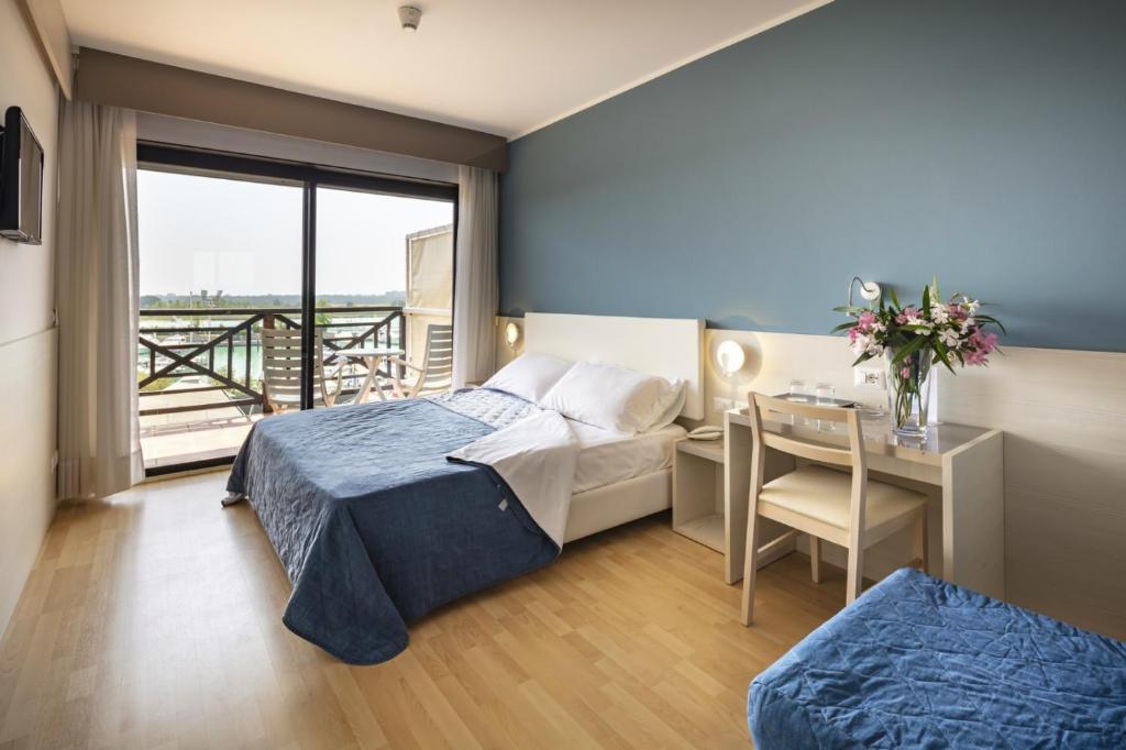 Кровать или кровати в номере Hotel Marina Uno