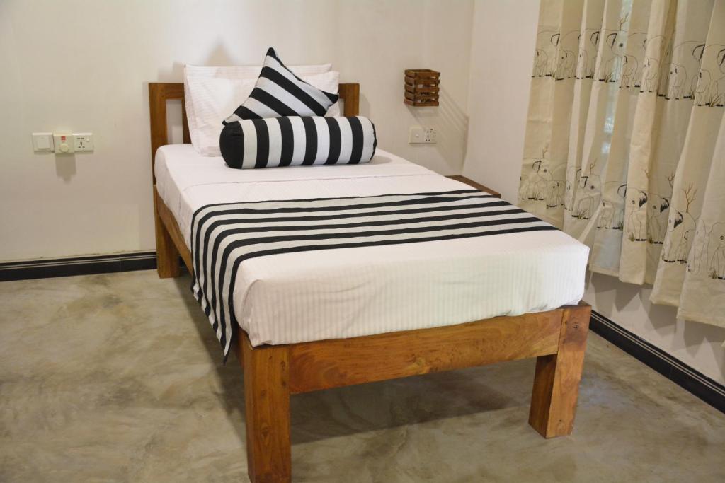 Postel nebo postele na pokoji v ubytování Jaye Eco Lodge