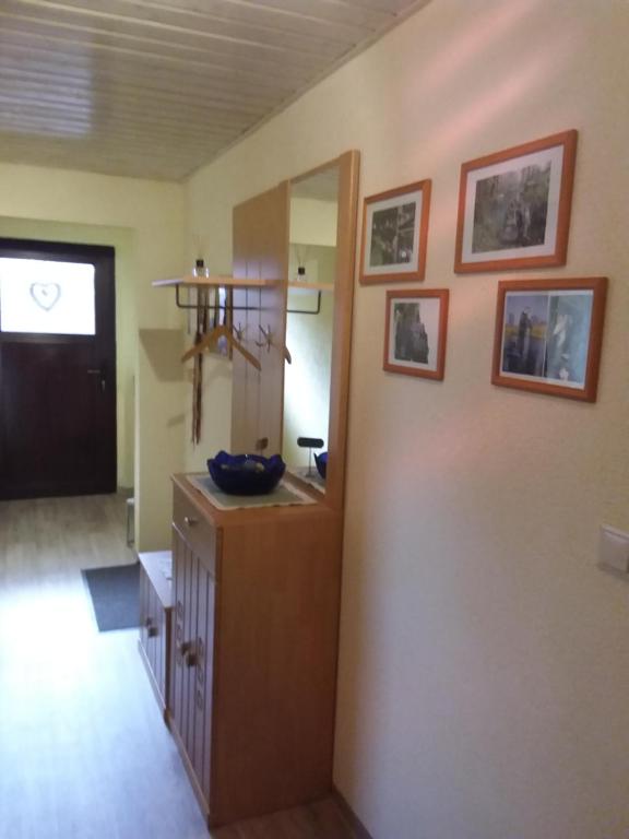 a room with a kitchen with a counter and a door at Ferìenwohnung Mende 2 in Lübbenau