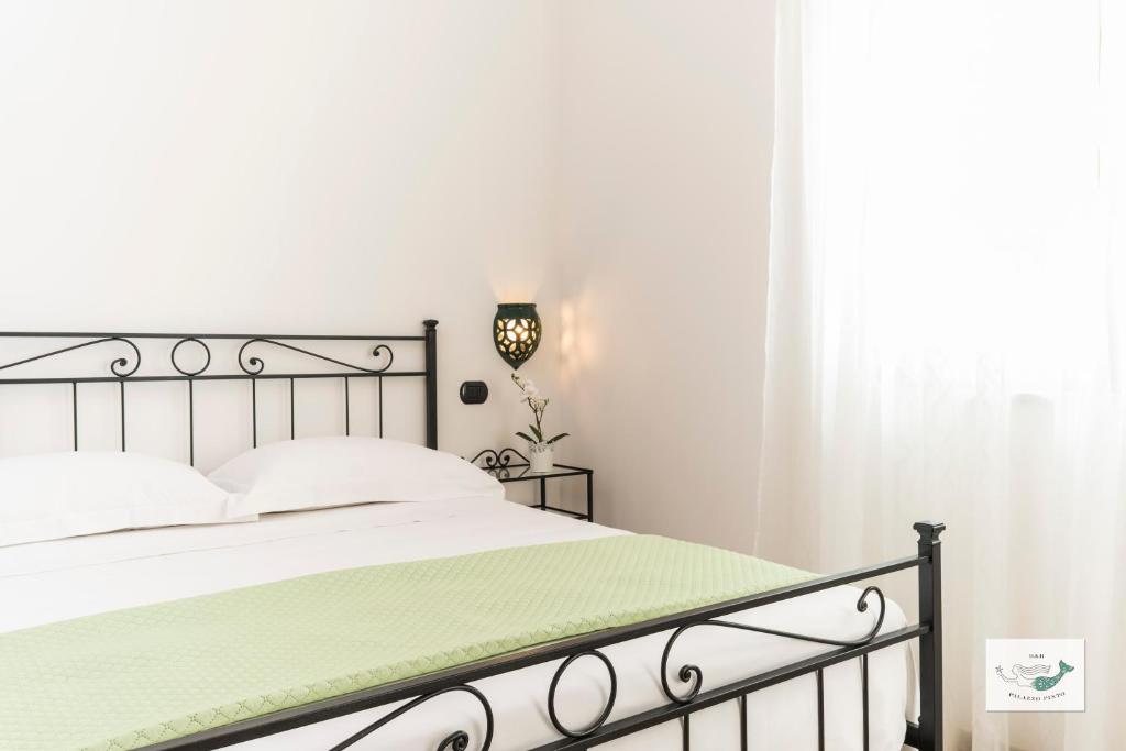 Posteľ alebo postele v izbe v ubytovaní B&B Palazzo Pinto 2