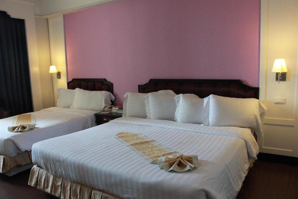 Postel nebo postele na pokoji v ubytování Charoen Thani Hotel, Khon Kaen