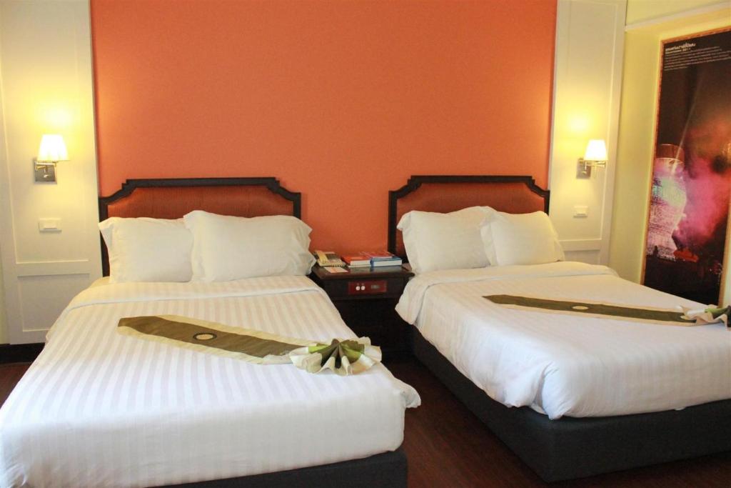 Postel nebo postele na pokoji v ubytování Charoen Thani Hotel, Khon Kaen