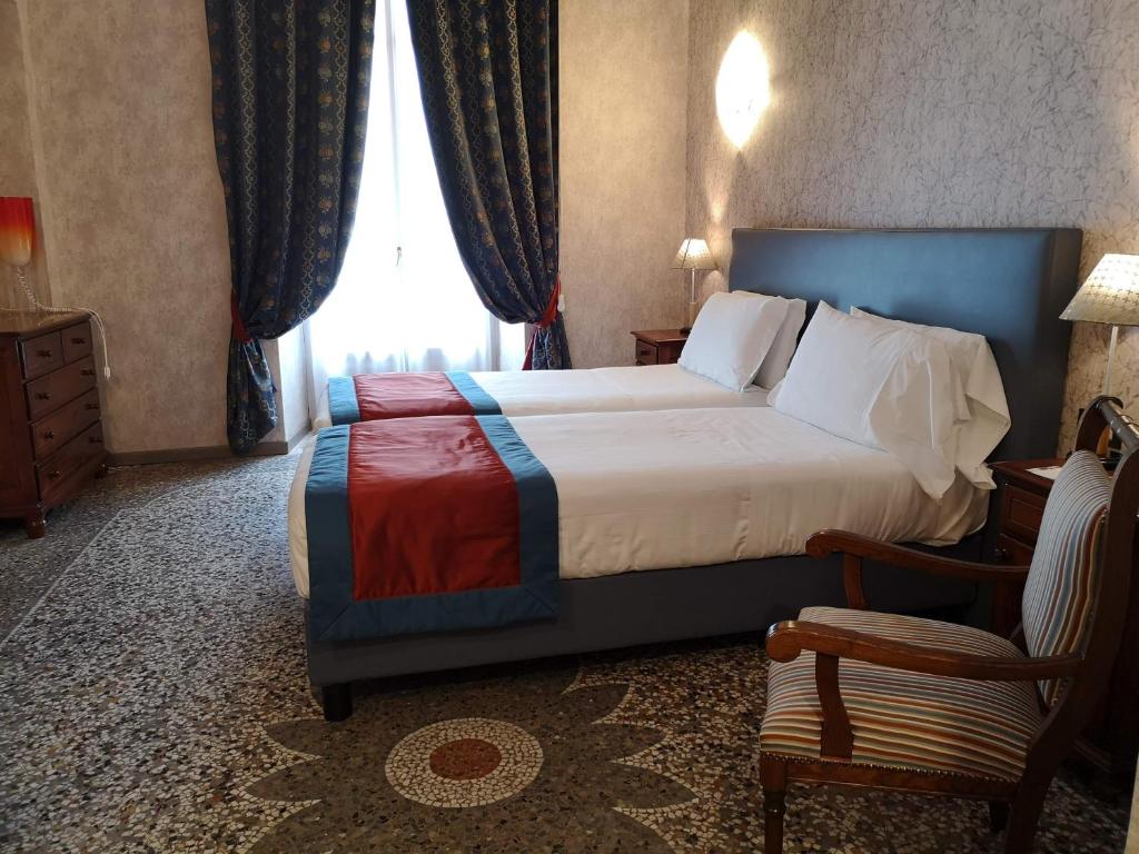 Postel nebo postele na pokoji v ubytování Best Western Hotel Genio