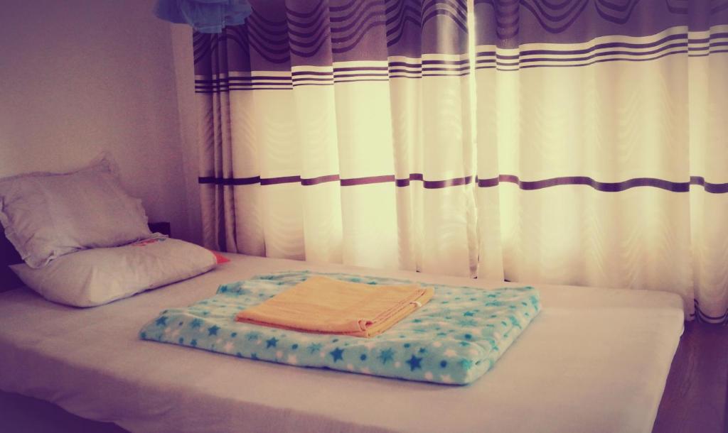 Postel nebo postele na pokoji v ubytování Deneth Homestay