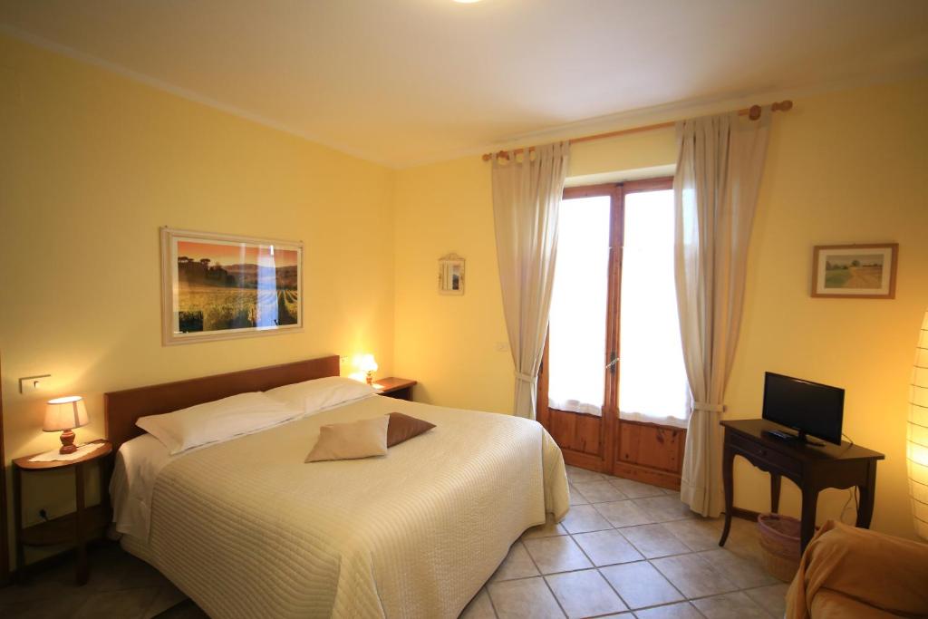 Postel nebo postele na pokoji v ubytování Casa Milena