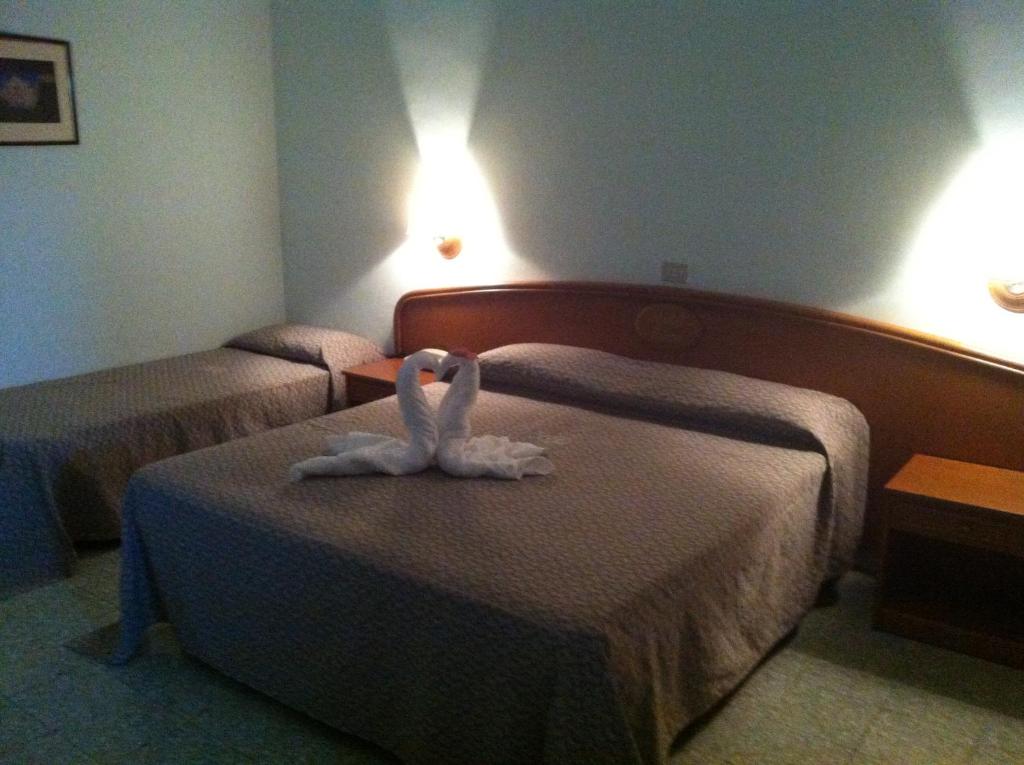 Postel nebo postele na pokoji v ubytování Hotel Eden