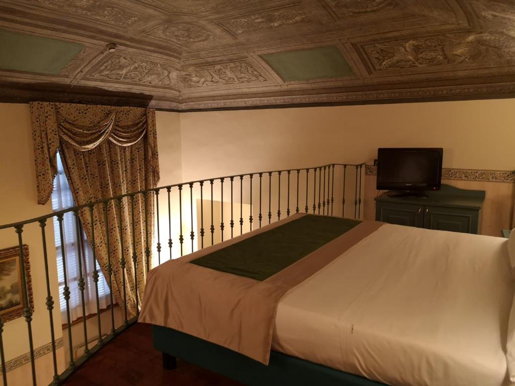 Postel nebo postele na pokoji v ubytování Best Western Hotel Genio