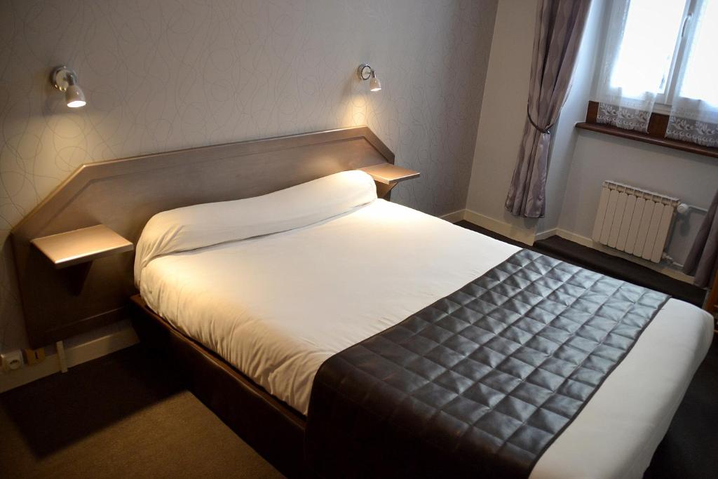 Postel nebo postele na pokoji v ubytování Hotel Angleterre