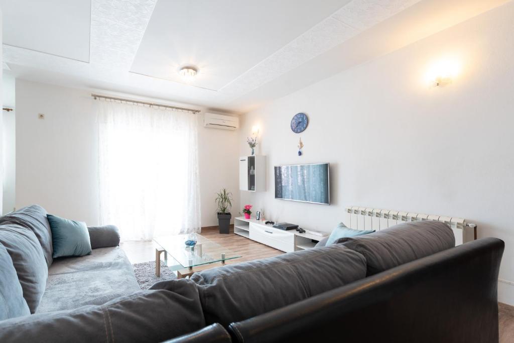 Posedenie v ubytovaní luxury apartment with garden jacuzzi and wellness