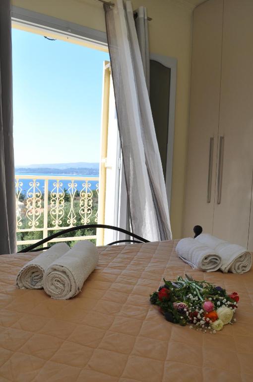 A bed or beds in a room at Polymnia Apartments Lassi