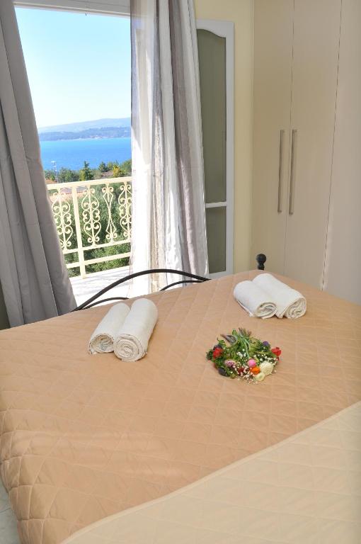 A bed or beds in a room at Polymnia Apartments Lassi
