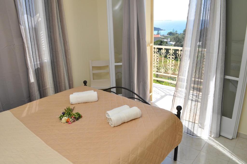 A bed or beds in a room at Polymnia Apartments Lassi