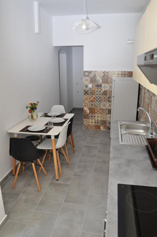 A kitchen or kitchenette at Polymnia Apartments Lassi