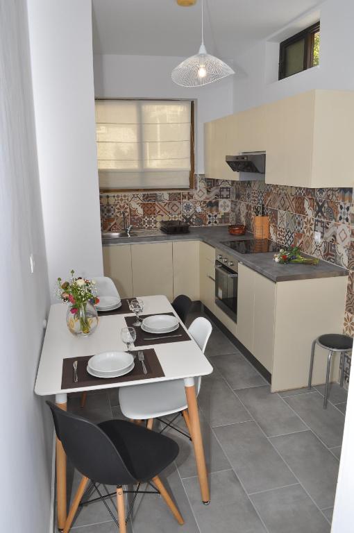 A kitchen or kitchenette at Polymnia Apartments Lassi