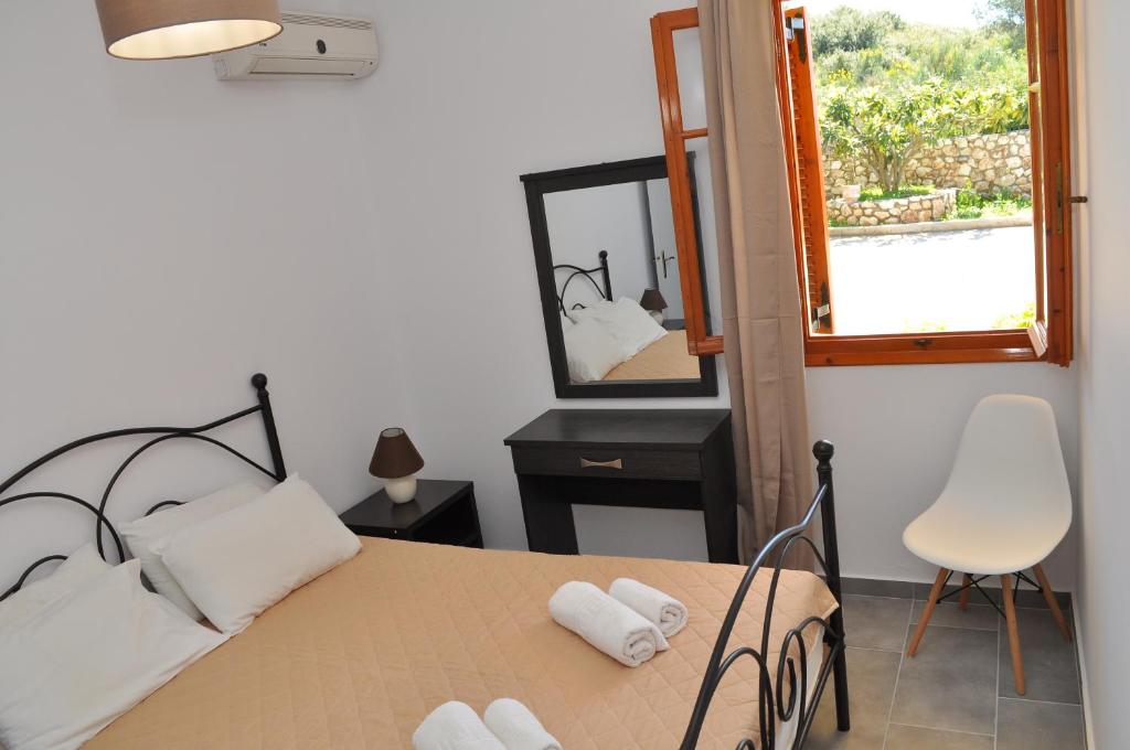 A bed or beds in a room at Polymnia Apartments Lassi