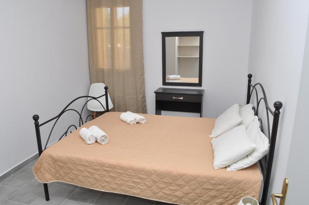 A bed or beds in a room at Polymnia Apartments Lassi